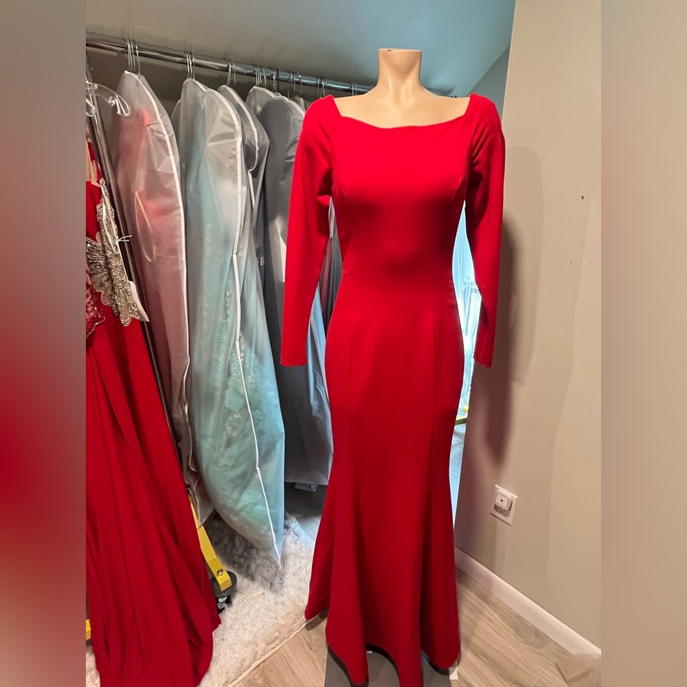 Sherri Hill. Size 8. Red Long Sleeve Gown with Gold Accent Zipper.